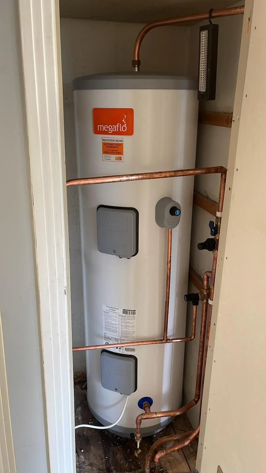 Megaflo unvented hot water cylinder installed in a cupboard in North Shields