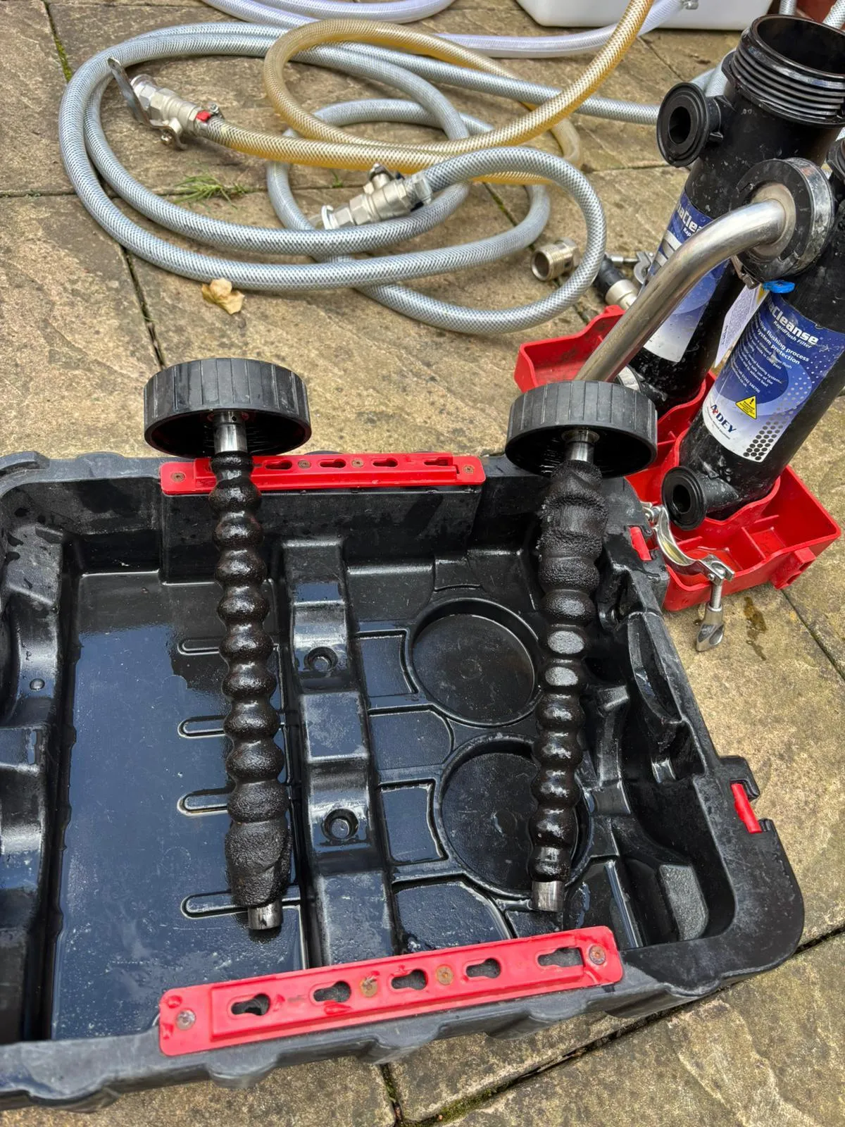 Sludge collected by magnetic filters during a central heating powerflush