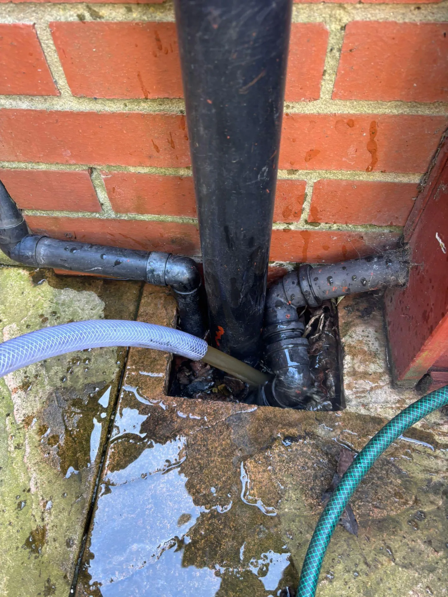 Dirty system water draining during a powerflush